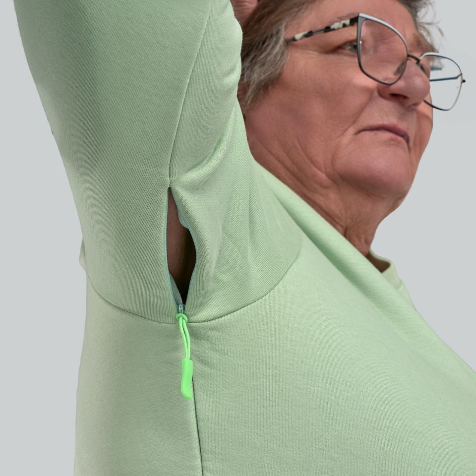 Sweat mixte ouverture velcro à l'épaule et des fermetures éclaires sur les côtés et passant au niveau des poignets vert